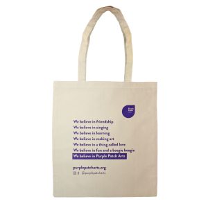 Tote bag with the Purple Patch logo on it and a poem